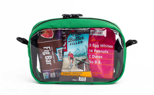 A Grass green 3D Clear Organizer Cube filled with sundries.